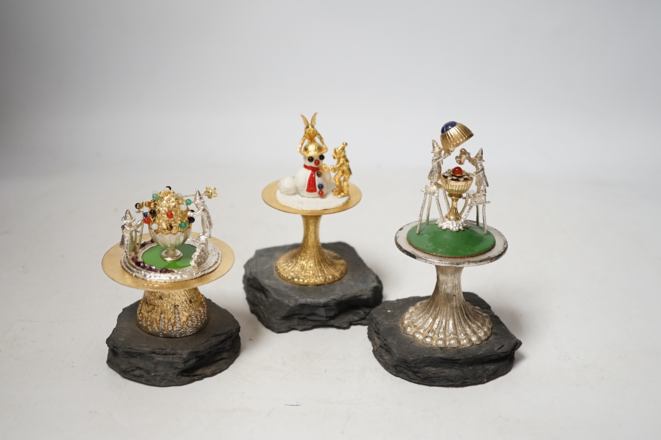 Three Elizabeth II limited edition surprise toadstools, by Christopher Nigel Lawrence, opening to reveal pixies at various pursuits, 1981/82/85, tallest 13.9cm, one cover apparently unmarked, all on simulated rock bases.